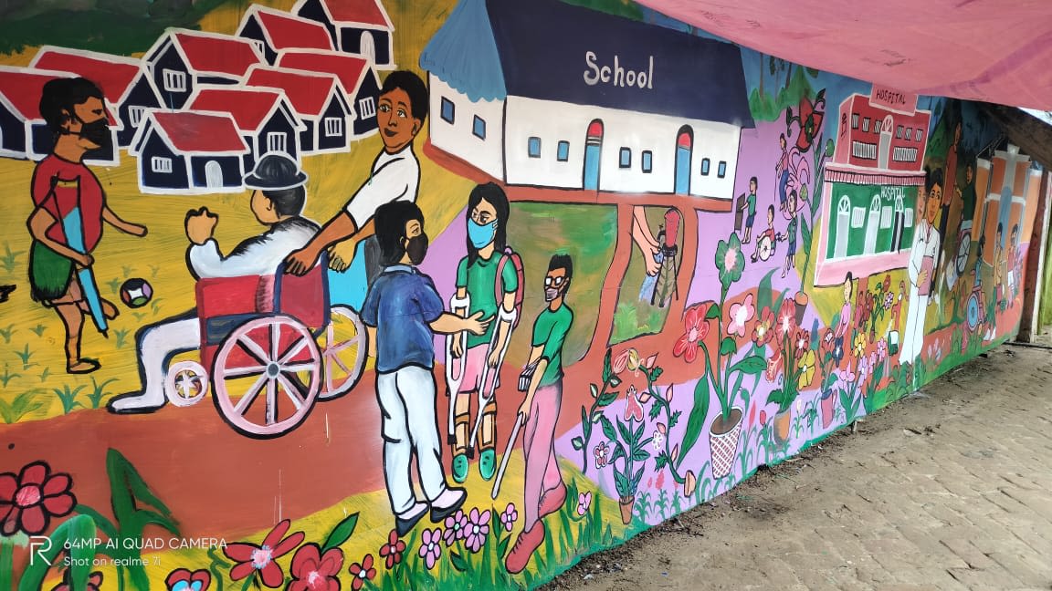 A mural of characters with disabilities in front of a school